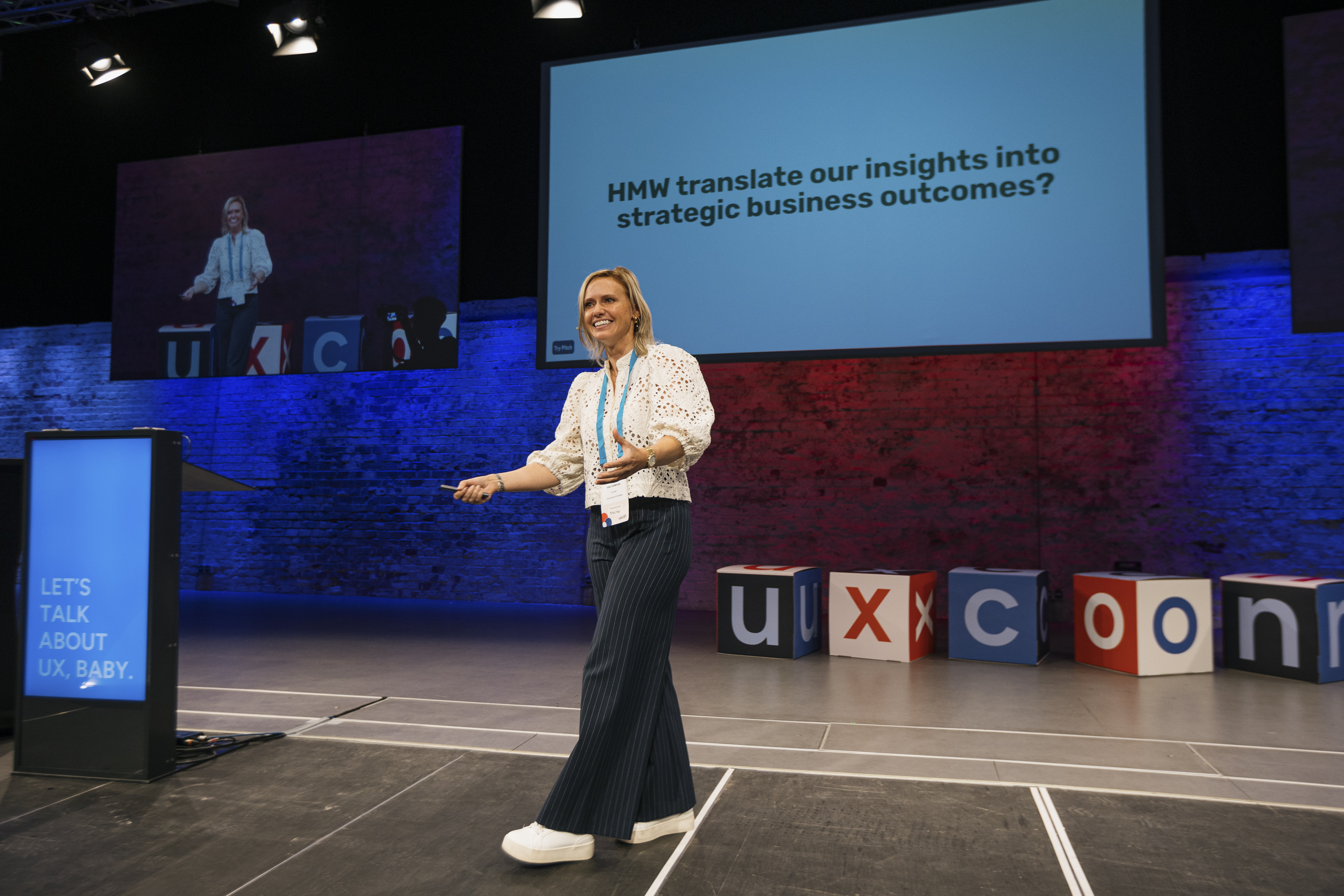 Nikki Anderson speaking on stage at UXcon